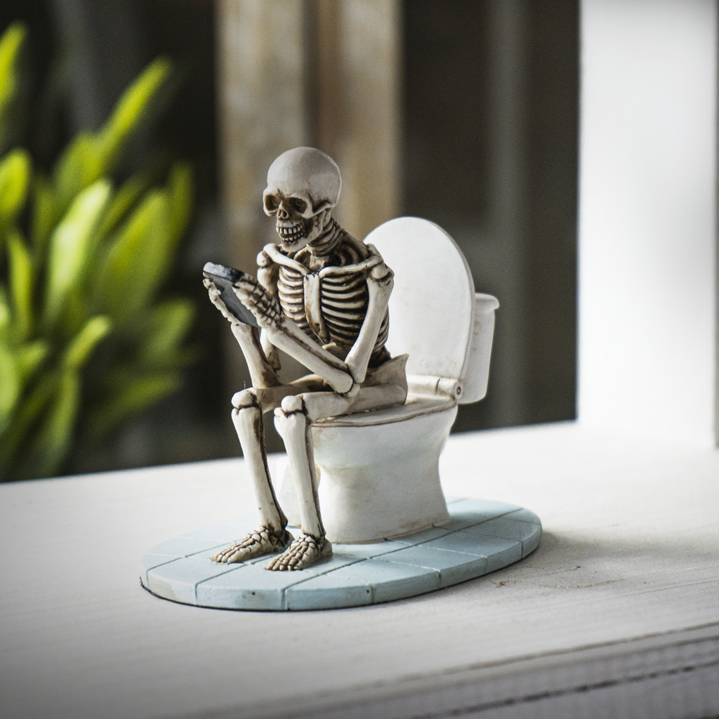 Skeleton on Toilet