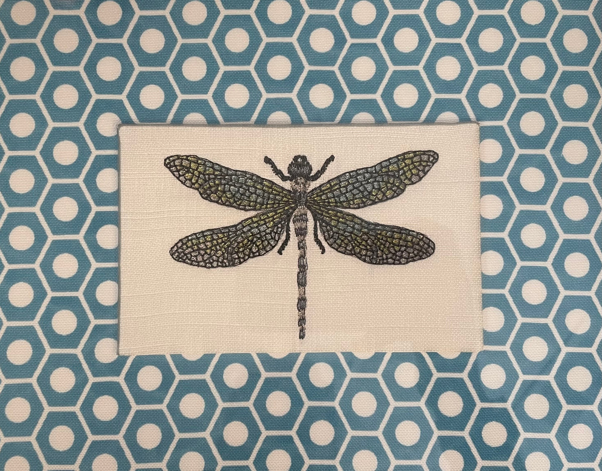Embroidered Dragonfly surrounded by Schumacher Queen B Custom Fabric Mat