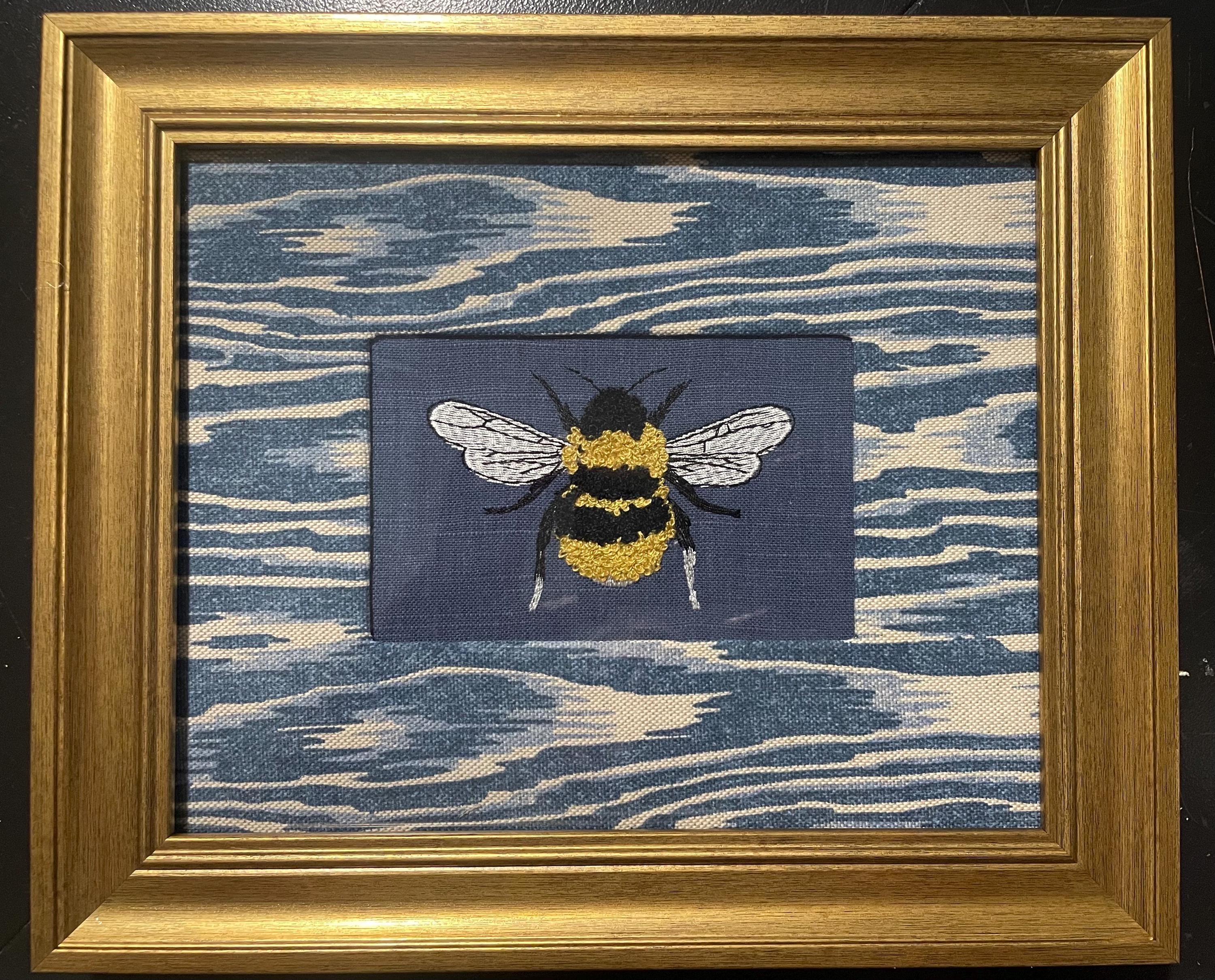 Adorable Bee surrounded by Ballard Designs Darcy Blue Fabric Mat