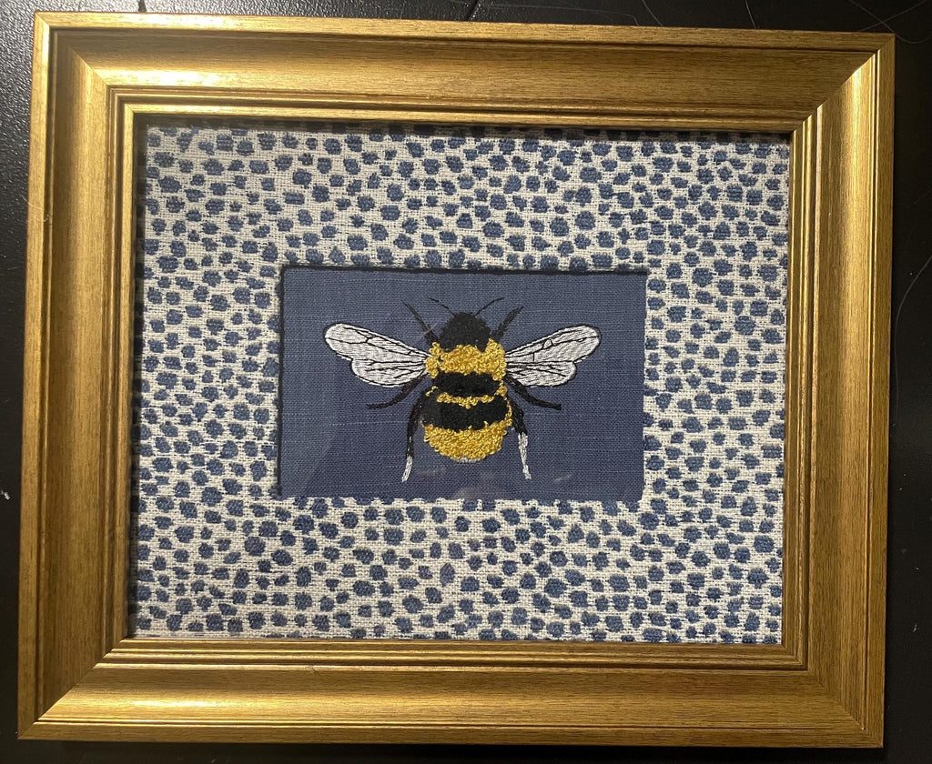 Adorable Bee surrounded by Ballard Designs Tully Blue Fabric Mat