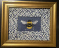 Adorable Bee surrounded by Ballard Designs Tully Blue Fabric Mat