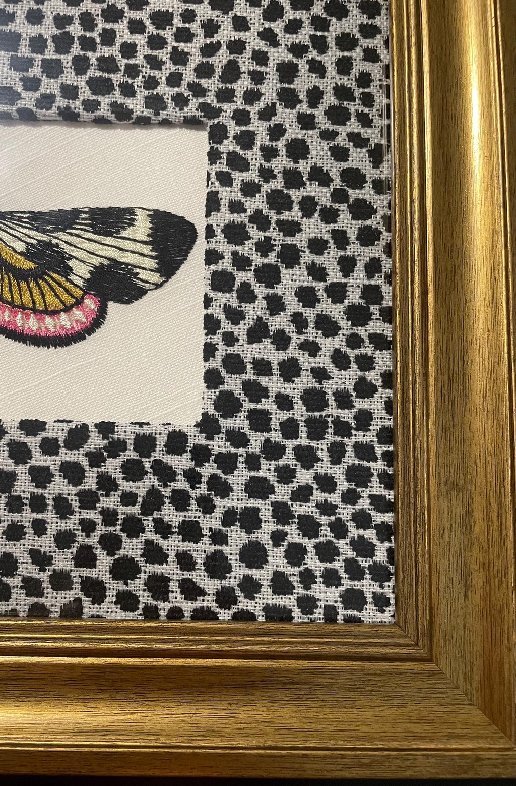 Embroidered Butterfly Moth surrounded by Ballard Designs Tully Ebony Fabric Mat