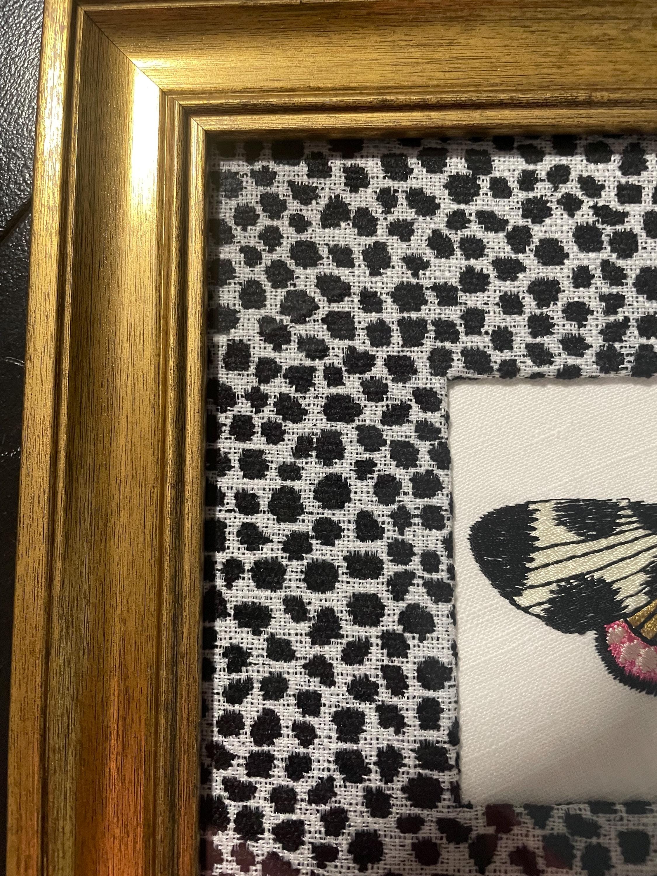 Embroidered Butterfly Moth surrounded by Ballard Designs Tully Ebony Fabric Mat