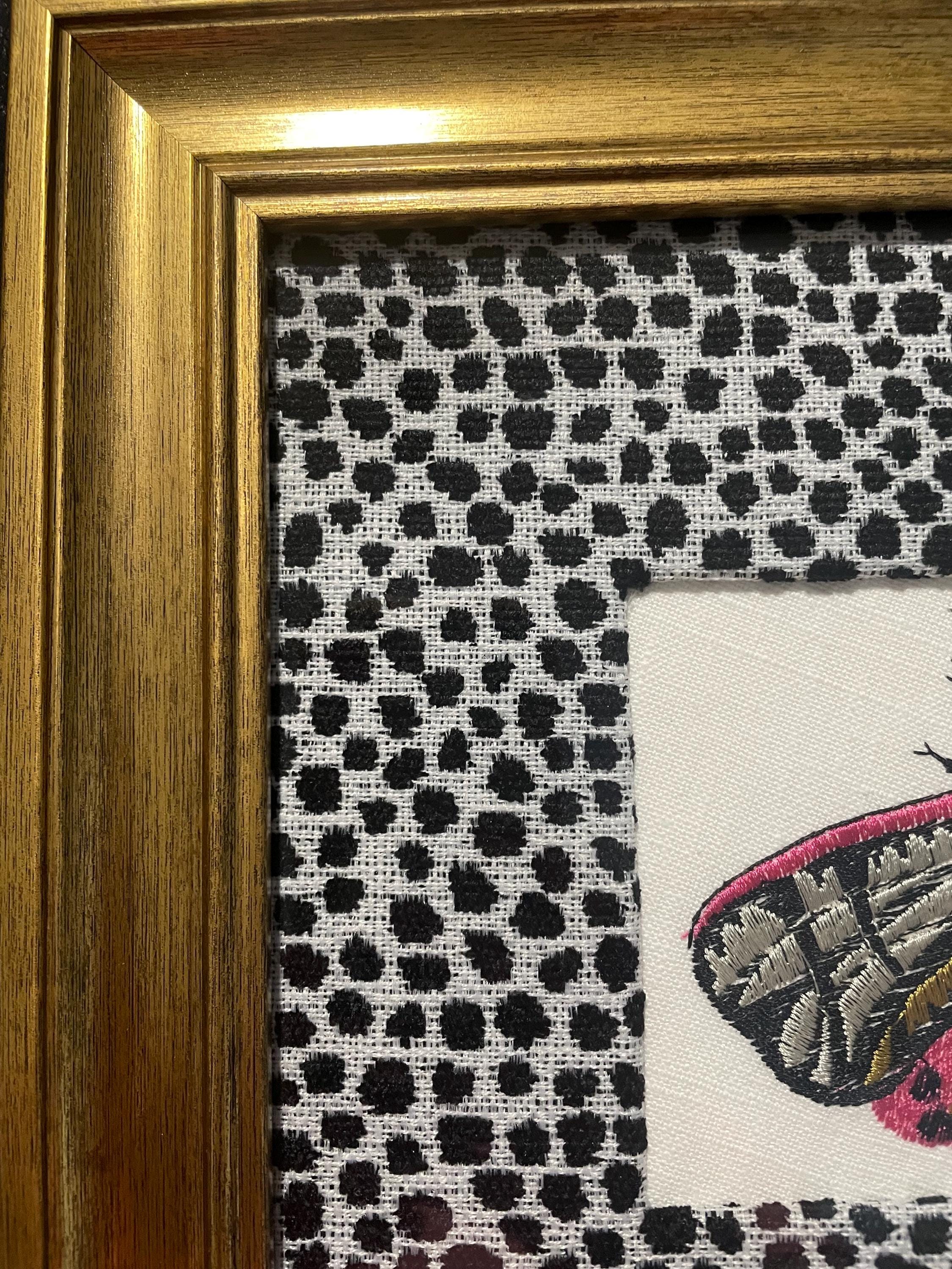 Embroidered Butterfly Moth surrounded by Ballard Designs Tully Ebony Fabric Mat