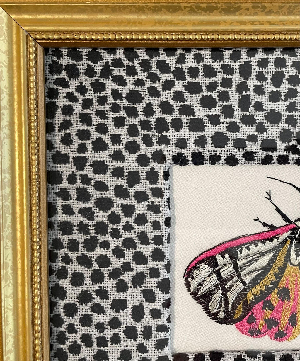 Embroidered Butterfly Moth surrounded by Ballard Designs Tully Ebony Fabric Mat