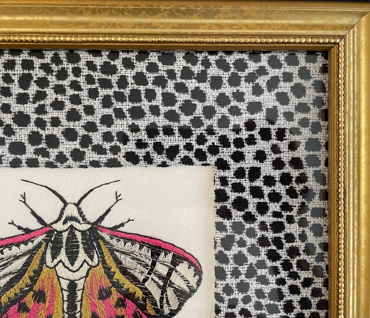 Embroidered Butterfly Moth surrounded by Ballard Designs Tully Ebony Fabric Mat