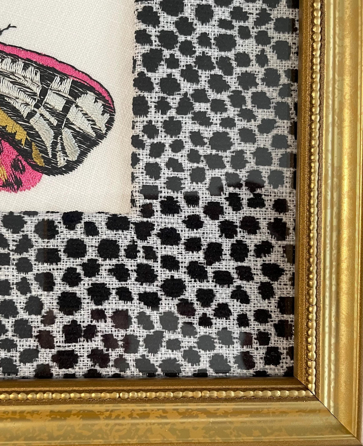 Embroidered Butterfly Moth surrounded by Ballard Designs Tully Ebony Fabric Mat
