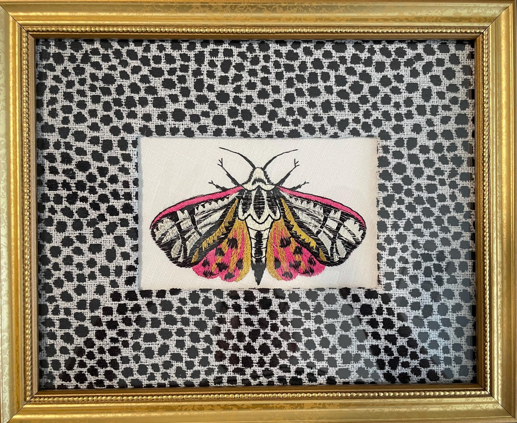 Embroidered Butterfly Moth surrounded by Ballard Designs Tully Ebony Fabric Mat